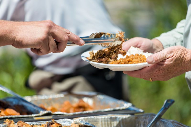 Grill Masters at Work: Dive into the Culinary Artistry Behind Our BBQ Catering Service Image